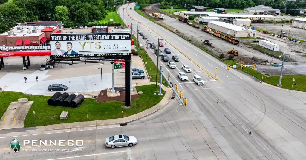 Billboard advertising at a busy intersection in Homer City, Pennsylvania near Sheetz, showcasing a Penneco Outdoor Advertising display.